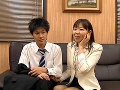 Japanese secretary having fun with her coworker in the office