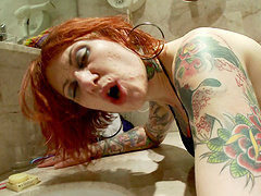Tattooed redhead Tallulah moans while getting fucked balls deep
