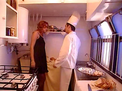 Retro porn video with a brunette wife being fucked in the kitchen