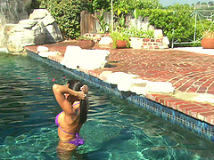 Lezley Zen enjoys while giving her boyfriend a blowjob by the pool