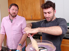 Video of two dudes making and eating food in the kitchen. HD