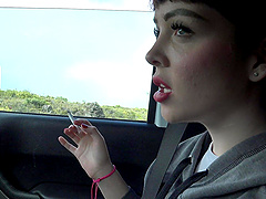 Cute brunette babe Aliya Brynn smoking a cigarette in the car