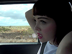 Cute brunette babe Aliya Brynn smoking a cigarette in the car
