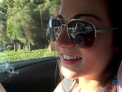Lovely teen Lily Adams has fun with her boyfriend in the car