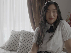 Asian cutie Mina Luxx showing off her new schoolgirl uniform