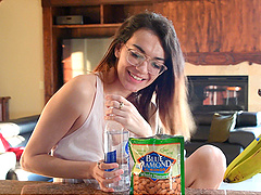 Glasses-clad girl teases in panties and crop top in the kitchen