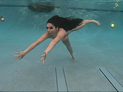 Long-haired brunette seductively strips down to poolside solo show