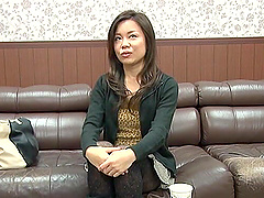 Beautiful asian woman with long hair undressing and exposing her big natural tits.