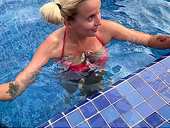 Blonde bombshell with natural tits blows a huge dick outside by the pool