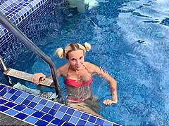 Blonde bombshell with natural tits blows a huge dick outside by the pool