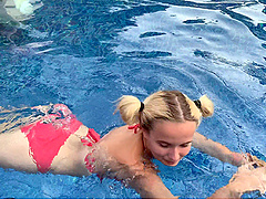 Blonde bombshell with natural tits blows a huge dick outside by the pool