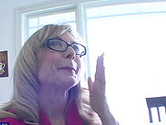 Mature Nina Hartley shows off her natural tits and pussy