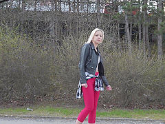 A cute blondie, Julia Parker, licks her shaved pussy with passion.