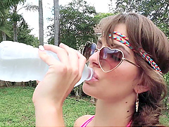 Kimmy's luscious locks sway in the sun as Tony feasts on her juicy naturals by the pool