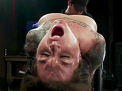 Tattoed chick goes through bondage session