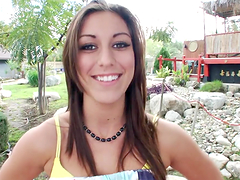 Sexy brunette gives one hell of a handjob outdoors