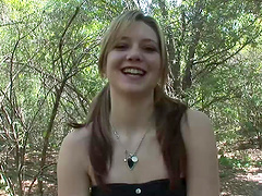 Outdoors solo scene with a kinky pigtailed blonde