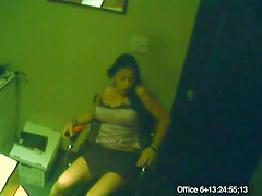 Hidden camera shows a hottie masturbating in the office