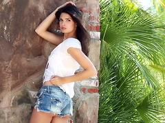 Beautiful brunette has solo pleasure outdoors.