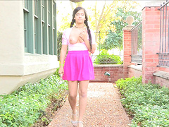 A beautiful brunette with natural tits wears pigtails and masturbates.