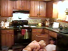 Hardcore fucking in the kitchen with an adorable blonde mature