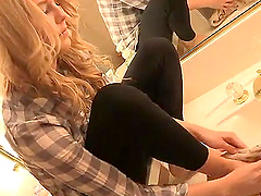 Horny blonde chick plays with her feet in the bathroom. HD video