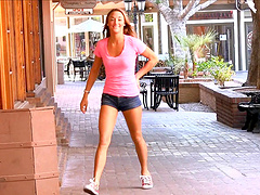 Young and beautiful girl with long hair makes a solo performance outdoors.