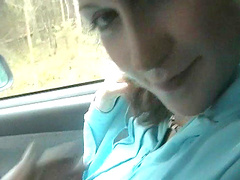 Young brunette gives a blowjob and gets a handjob in a car