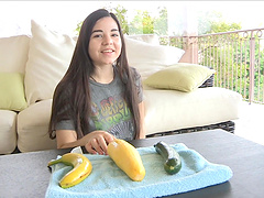 Naughty chick pleasures her pussy with a banana and a cucumber
