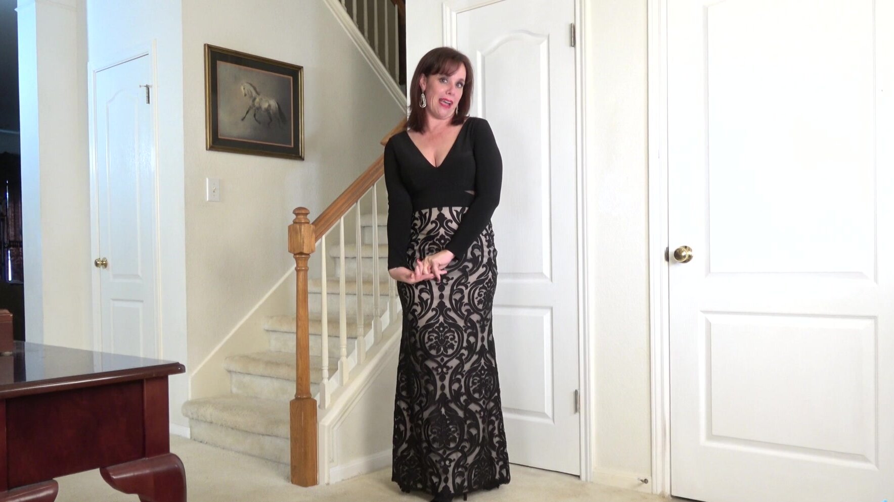 Mature brunette bares her natural tits and plays with her shaven pussy in a steamy solo scene