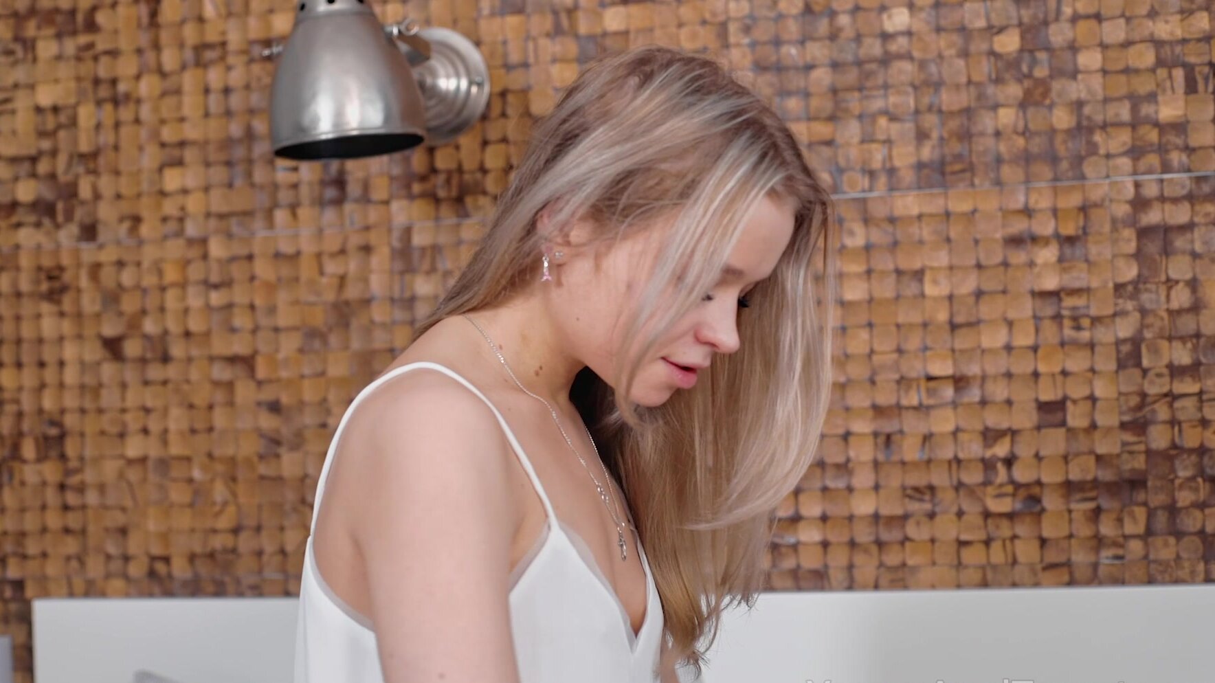 A beautiful blondie has long hair and small tits, showcasing her stunning Calibri charm.