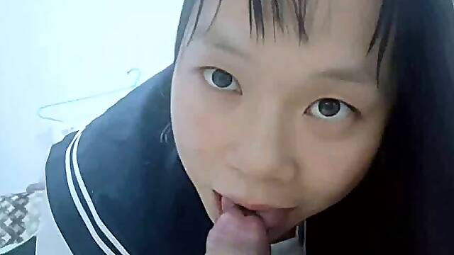 Chinese girl performs oral sex and swallows semen.