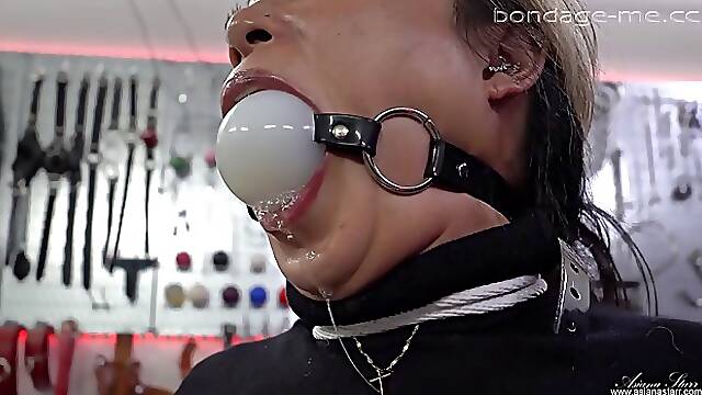 Sexy brunette MILF gets tied up and ballgagged