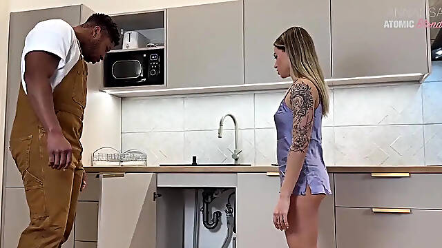 Blonde slutty wife deep throats huge black plumber's cock in the kitchen