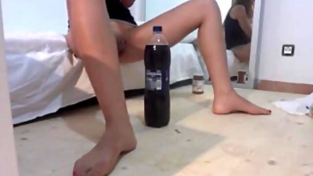 Crazy blonde takes a bottle of cola deep into her pussy