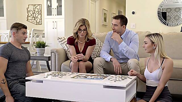 Four sexy babes enjoy a hot foursome on the sofa