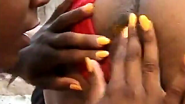 Two hot beautiful ebony chicks are getting their pussies drilled in the garden