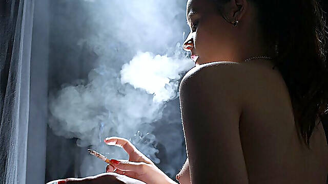 Young Brunette Smoking in Red Tulle Skirt